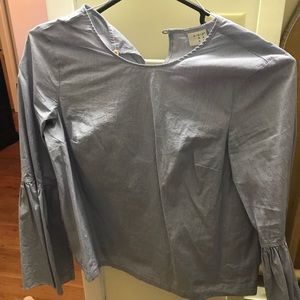 Navy and white stripe shirt with bell sleeves.